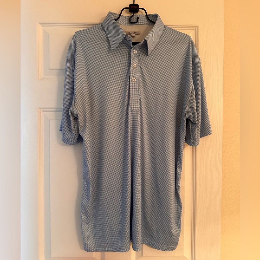 Polo shirt by Collars & Co in light blue. 2XL but fits like XL.